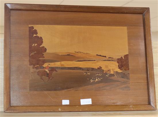 An inlaid wooden panel of a fox hunting scene by A.H. McIntosh